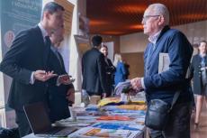 Air quality managers discuss with event visitors